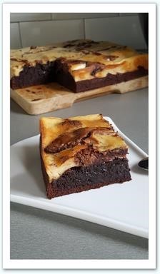 Brownie Cheesecake Nutella & Bailey's Un brownie moelleux au délicieux goût de nutella, relevé par une touche de crème de whisky. A découvrir absolument !