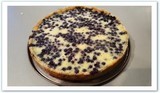 Tarte aux myrtilles Alsacienne sablé fin garnie d'un appareil à flan, et de myrtilles sauvages